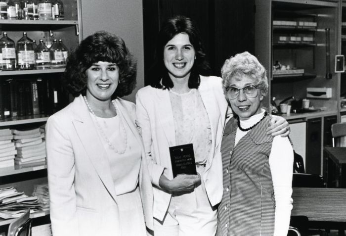 NCCC Nursing Faculty Cathy Peuquet and Elena Perone presenting an achievement award to student, 1985