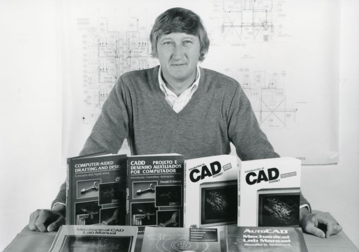 Engineering Technology Professor Don Voisinet with his recently published books, 1988