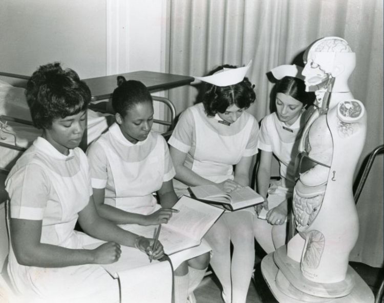 Nursing students reviewing coursework, circa 1968