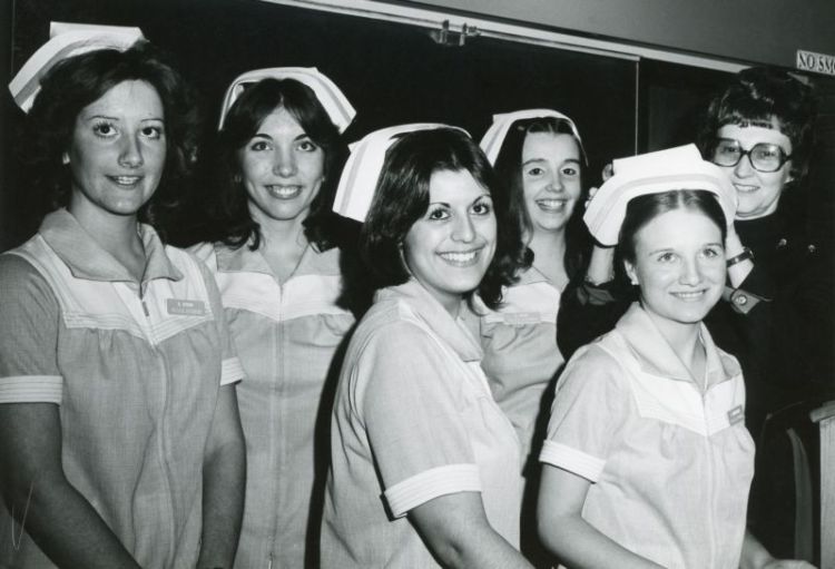 Dental Assisting students and Professor Dorothy Oldham-Bonner at capping ceremony, 1977