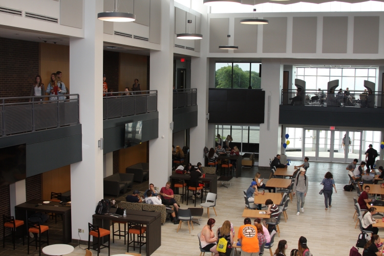 Students utilizing the atrium in the Learning Commons.