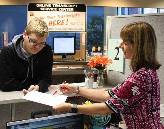 student with NCCC staff member