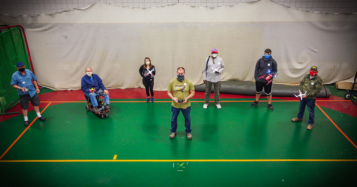 Students smile underneath their masks during the NCCC Workforce Development Drone Operator Class.