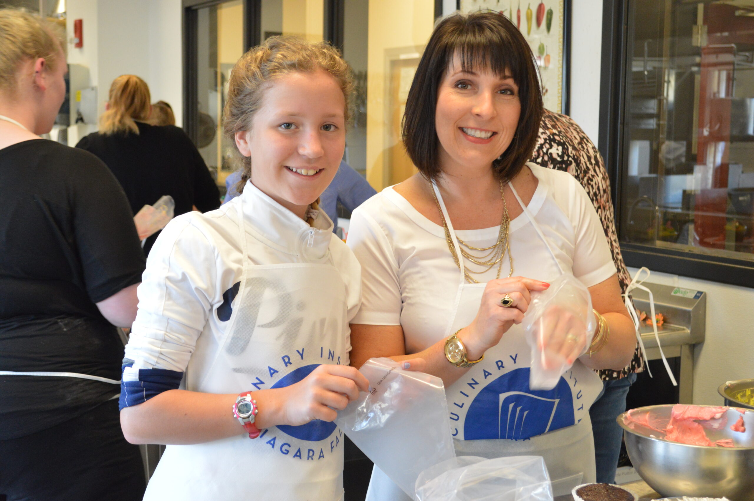 Two community education class students working on food