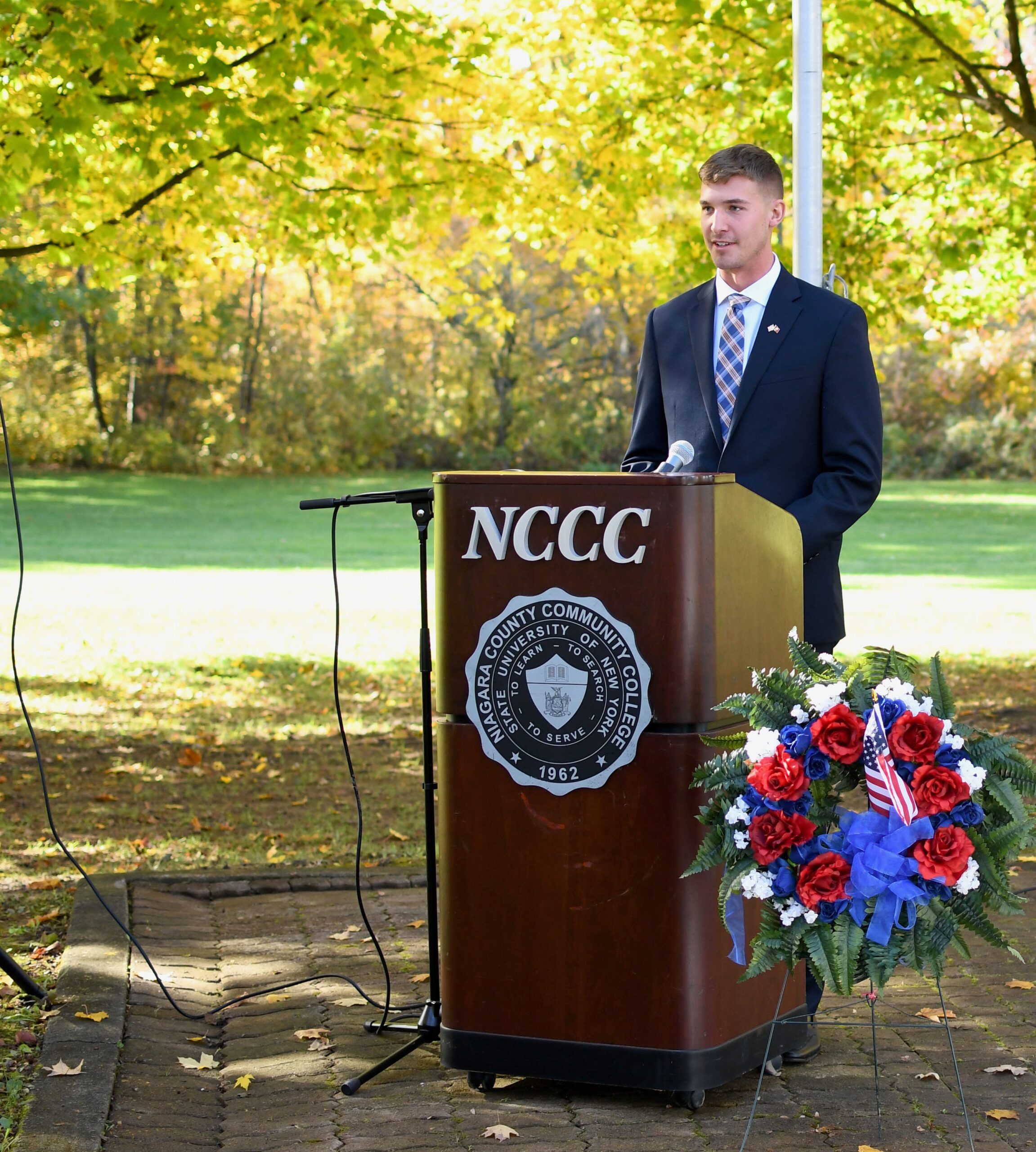 Joseph Karl, Veteran USMC, speaking at podioum