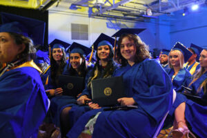 Graduates: NCCC graduates show off their diplomas after walking the stage.